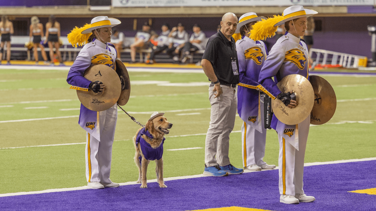 Service Dog Steals the Show as a Marching Band Performer 2 Winnie and Riessen playing with the marching band 1