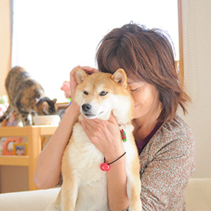 Kabosu with Atsuko Sato doge coin dog