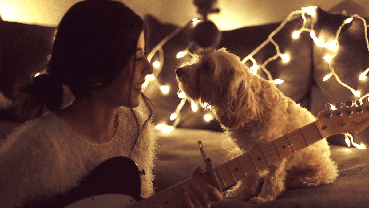 Daniela serenading her dog Dani