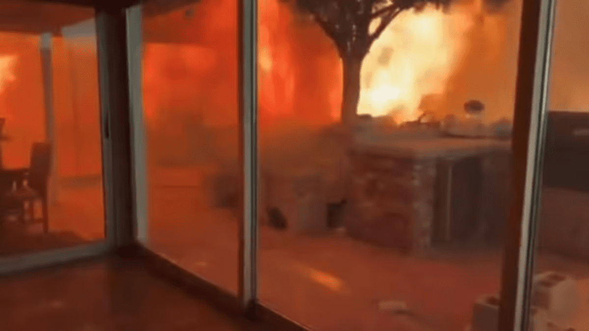 A home in Los Angeles surrounded by wildfires